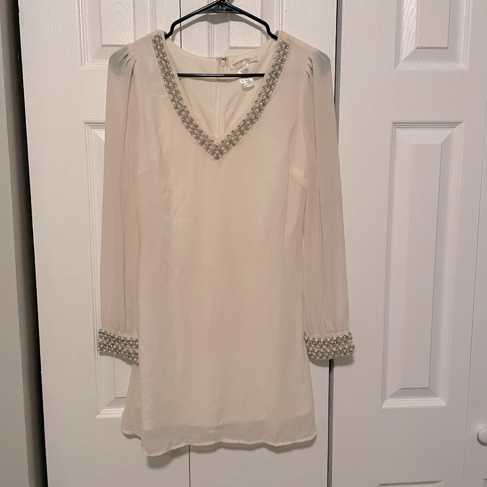 White chiffon dress with beaded neck and cuffs